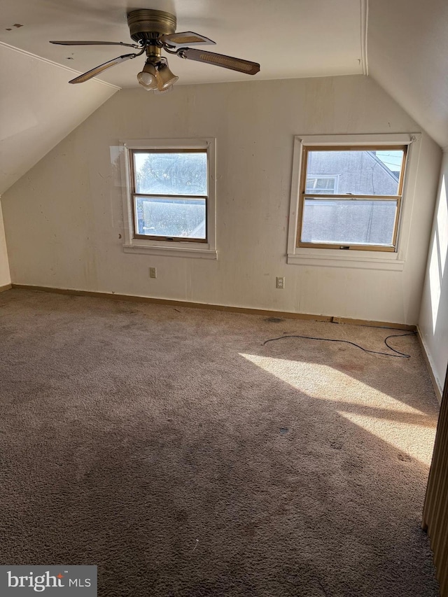 bonus room featuring carpet flooring, ceiling fan, and vaulted ceiling