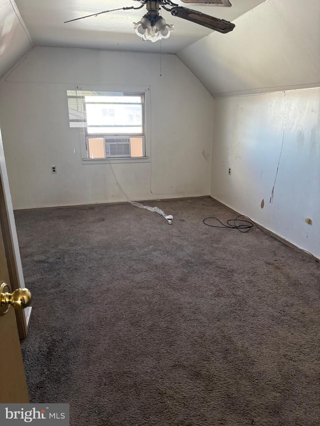 bonus room with ceiling fan, cooling unit, dark carpet, and vaulted ceiling