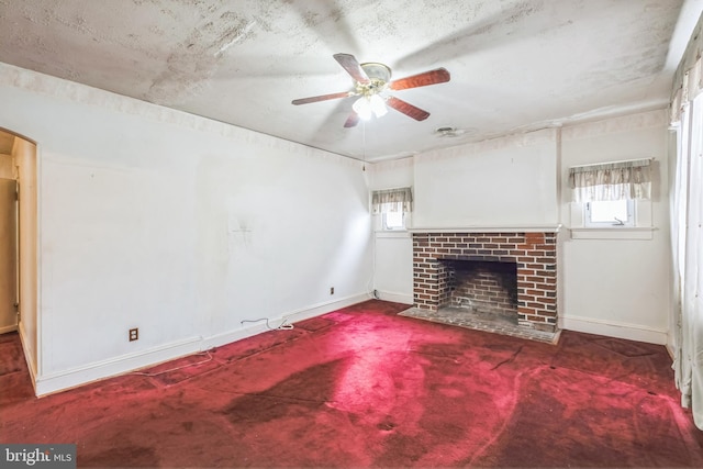 unfurnished living room featuring a fireplace and ceiling fan