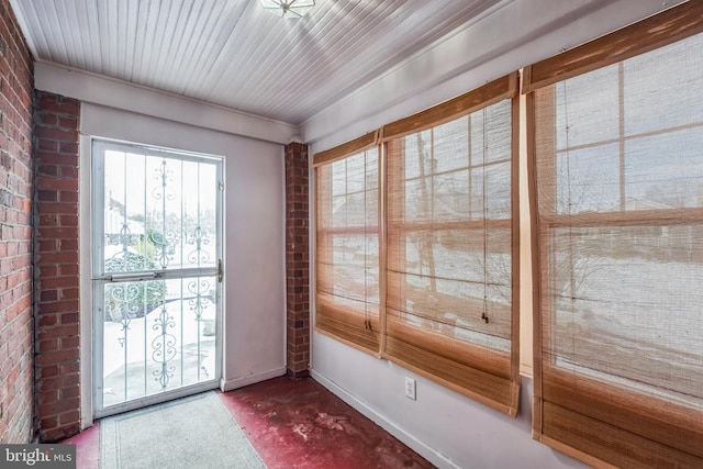 doorway to outside with carpet floors