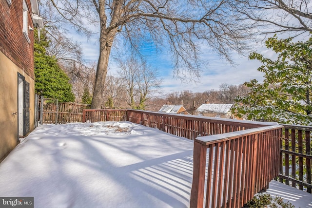 view of snow covered deck