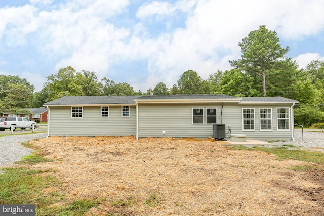 rear view of house with a patio area and central air condition unit