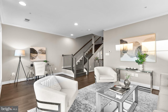 living room with ornamental molding and dark hardwood / wood-style flooring