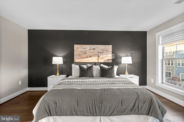 bedroom featuring dark hardwood / wood-style floors