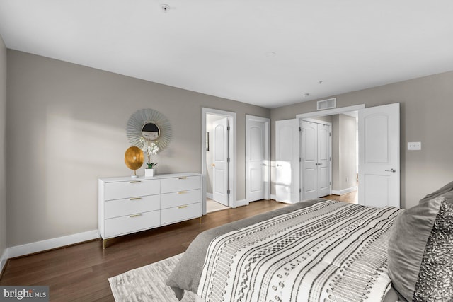 bedroom featuring dark wood-type flooring