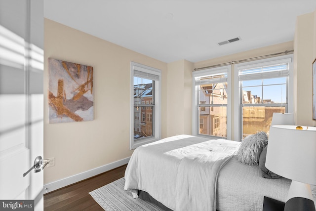 bedroom featuring dark hardwood / wood-style floors