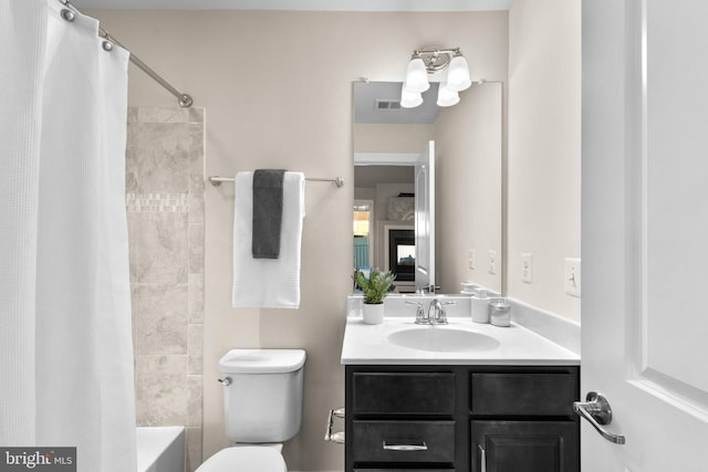 full bathroom with toilet, vanity, and shower / tub combo with curtain