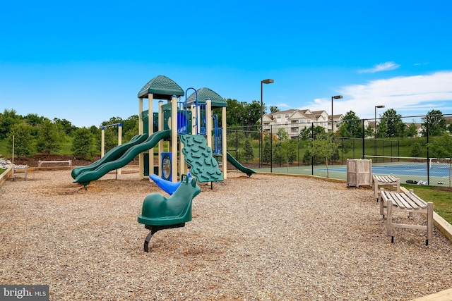 view of jungle gym with tennis court