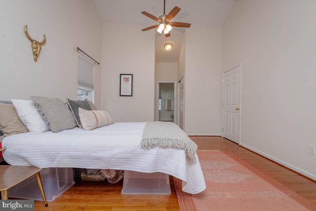 bedroom with hardwood / wood-style floors and ceiling fan