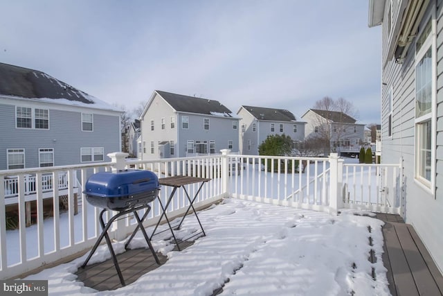 snow covered deck with area for grilling