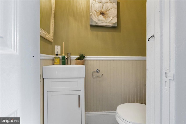 bathroom featuring toilet and vanity