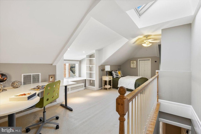 carpeted office featuring lofted ceiling and ceiling fan