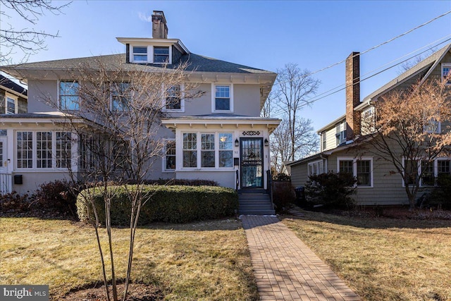 view of front of home with a front yard