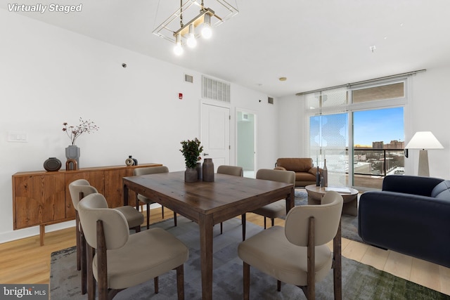 dining space featuring light hardwood / wood-style floors