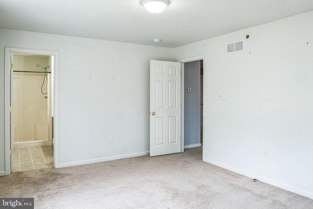 unfurnished room with light colored carpet