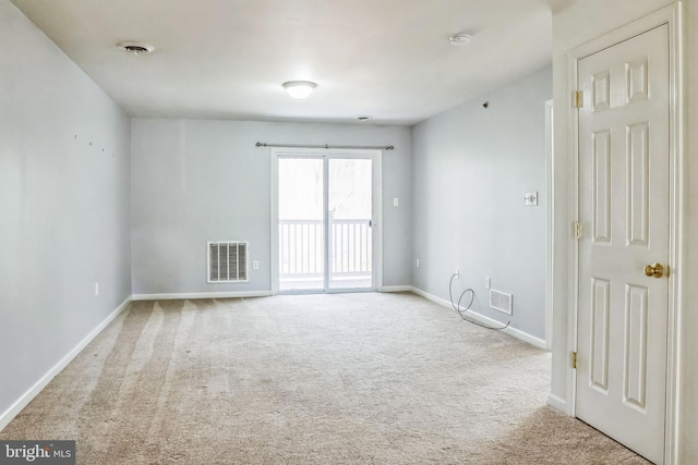 unfurnished room with light colored carpet