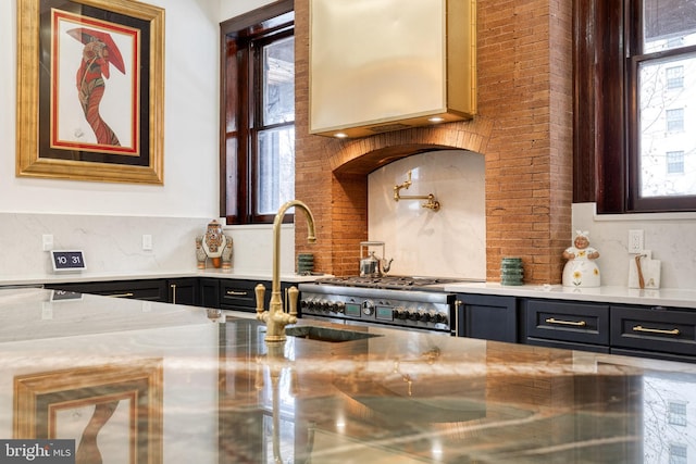 kitchen with range and decorative backsplash