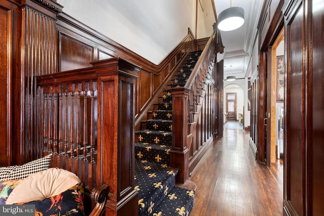 interior space with crown molding and hardwood / wood-style flooring