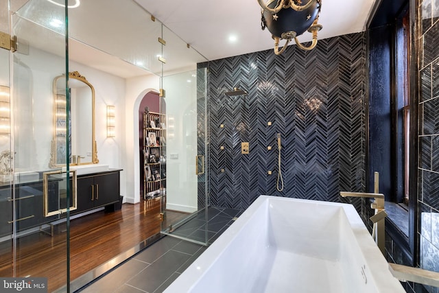 bathroom featuring tile walls, vanity, and tile patterned flooring