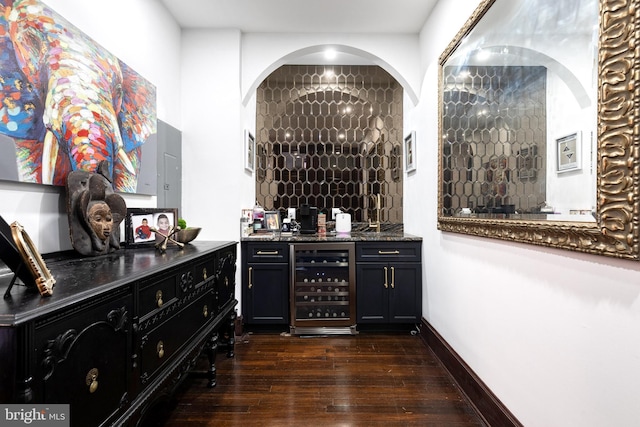 bar featuring wine cooler and dark hardwood / wood-style flooring