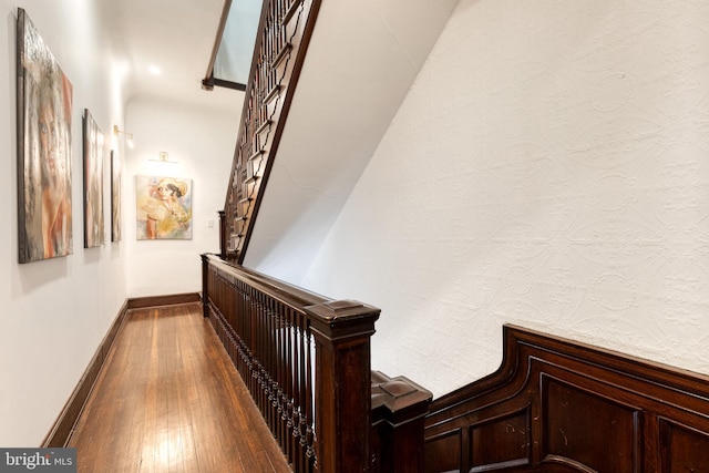 corridor featuring wood-type flooring