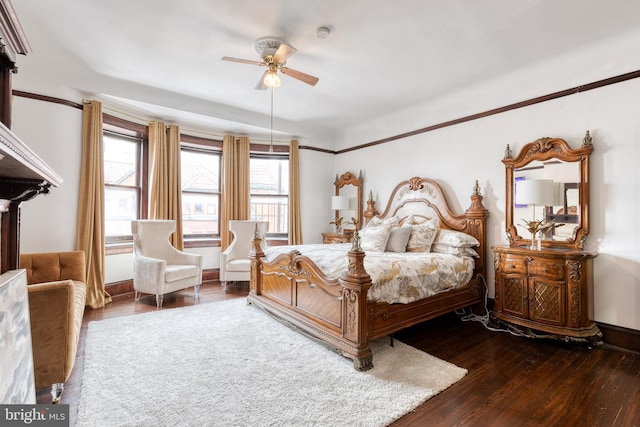 bedroom with ceiling fan and dark hardwood / wood-style flooring