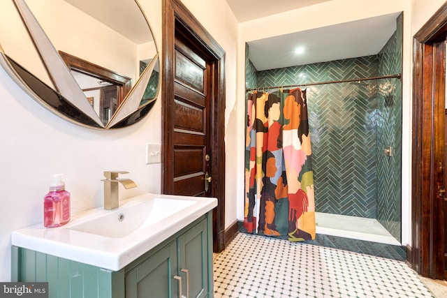 bathroom featuring vanity and a shower with shower curtain