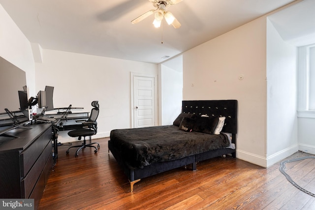 bedroom featuring wood-type flooring and ceiling fan