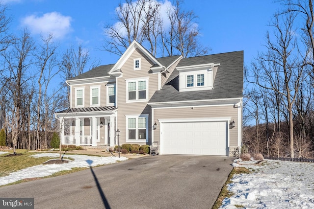 view of front of house with a porch and a garage