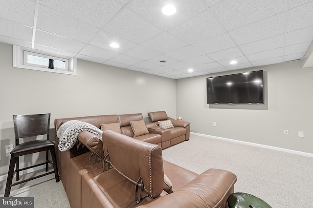 home theater with a drop ceiling and light colored carpet