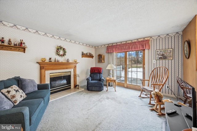 living room featuring carpet flooring and a textured ceiling