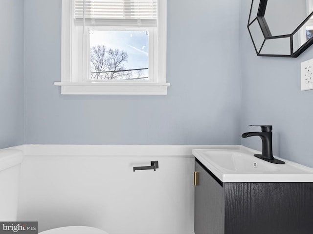 bathroom with vanity and toilet