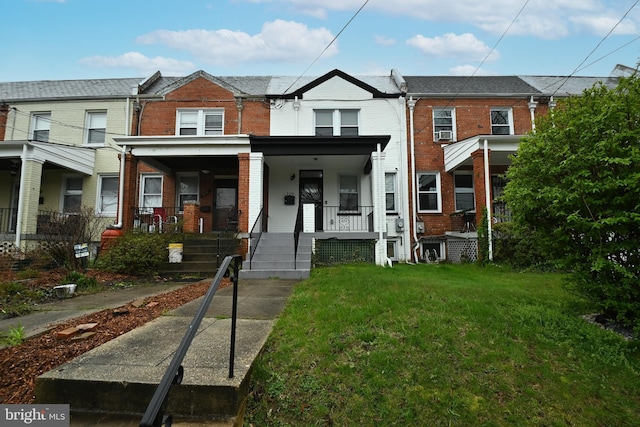 townhome / multi-family property with a porch