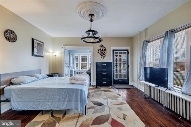 bedroom featuring dark wood-type flooring