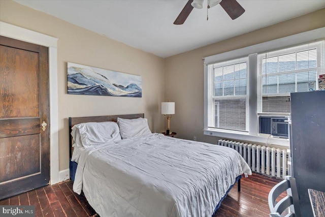 bedroom featuring radiator, ceiling fan, and dark hardwood / wood-style floors