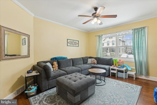 living room featuring crown molding, dark hardwood / wood-style flooring, and ceiling fan