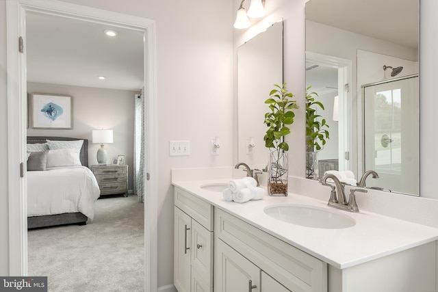 bathroom featuring vanity and an enclosed shower