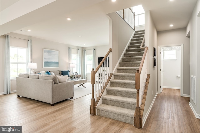 stairway featuring wood-type flooring