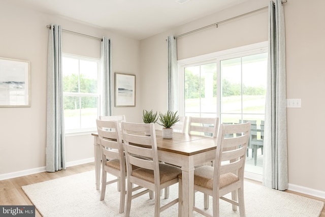 dining area with light wood-type flooring