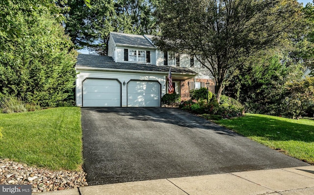 front of property with a garage and a front yard