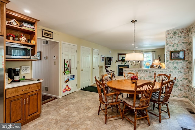 dining room featuring a fireplace