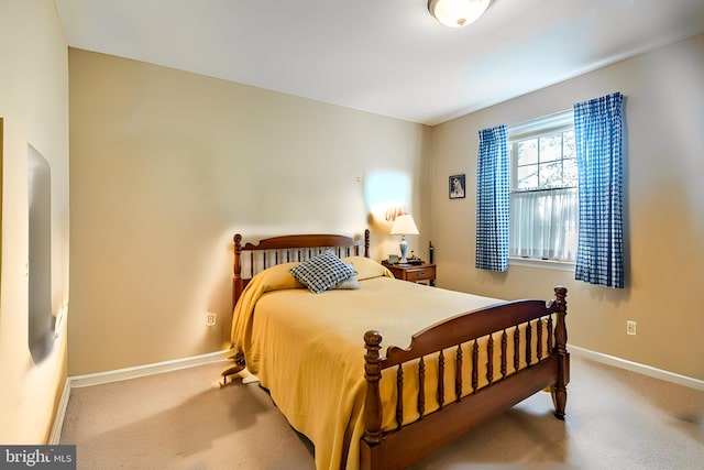 bedroom featuring carpet