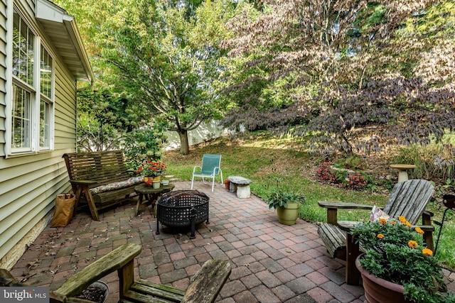 view of patio / terrace featuring a fire pit