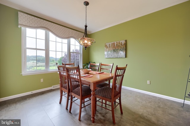 dining room featuring ornamental molding