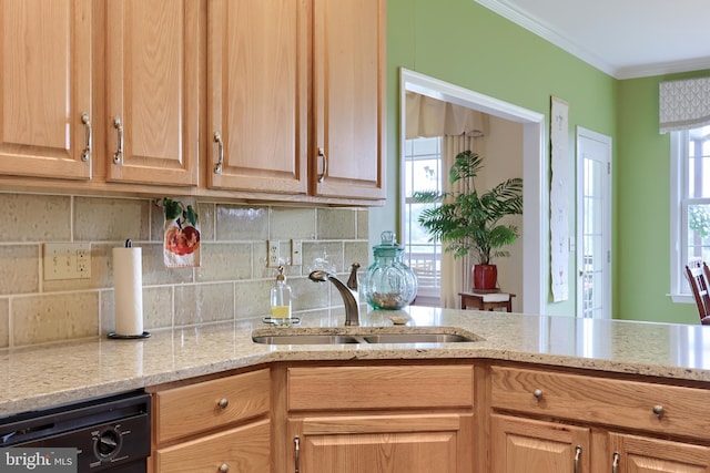 kitchen featuring dishwasher, ornamental molding, sink, and tasteful backsplash