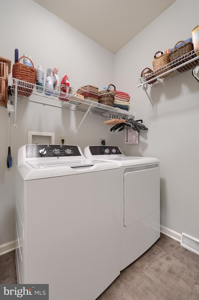 laundry room with independent washer and dryer