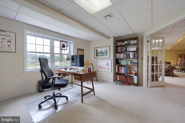 office with carpet flooring and a paneled ceiling