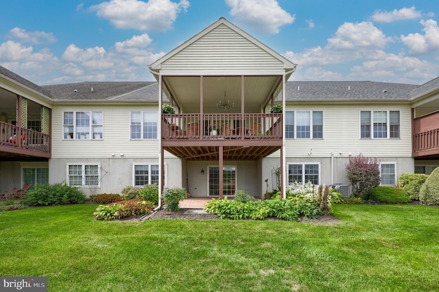 rear view of house featuring a patio area, a yard, and central AC unit