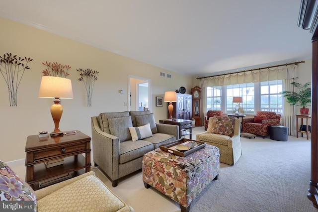 carpeted living room with crown molding