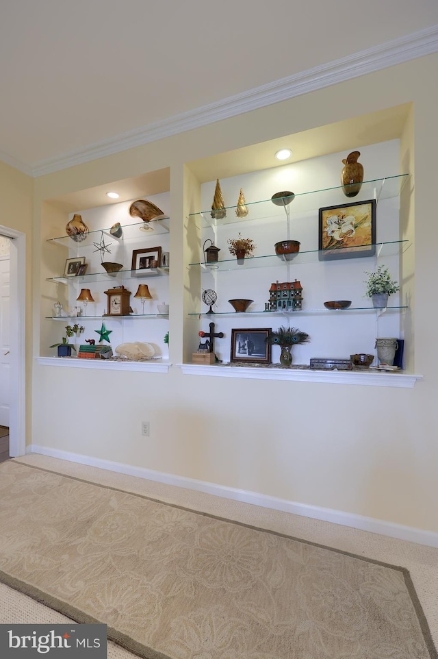 bar with built in shelves and ornamental molding